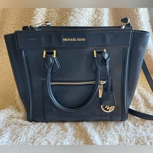 Michael Kors black leather bag.